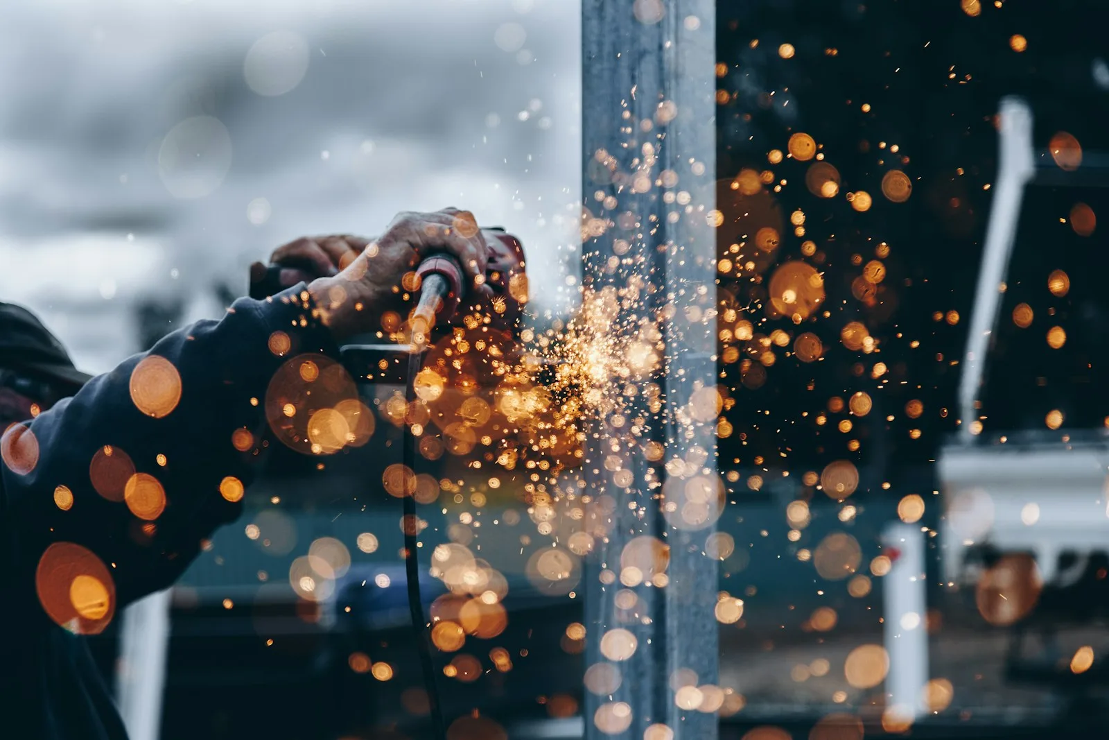 A metalworker shaping material in a workshop